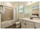 Bathroom featuring a shower and bathtub combo, and a vanity with a granite countertop at 2958 Salted Rim Rd, Kissimmee, FL 34747