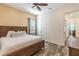 A bedroom featuring stylish decor and wood-look tile floors at 2958 Salted Rim Rd, Kissimmee, FL 34747