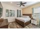 Comfortable bedroom with stylish decor and wood-look tile floors at 2958 Salted Rim Rd, Kissimmee, FL 34747