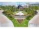 Welcoming entrance to the community, featuring manicured landscaping, American and Florida state flags at 2958 Salted Rim Rd, Kissimmee, FL 34747