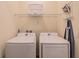 Functional laundry room with new, front-loading washer and dryer at 2958 Salted Rim Rd, Kissimmee, FL 34747