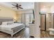 Serene main bedroom with king bed, bathroom access, and tranquil decor at 2958 Salted Rim Rd, Kissimmee, FL 34747