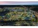 A nighttime aerial of the community showcasing the water park and resort with illuminated features at 2958 Salted Rim Rd, Kissimmee, FL 34747