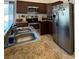 Well-lit kitchen featuring stainless steel appliances and light brown countertop at 299 Chicago W Ave, Haines City, FL 33844