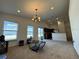 Open-concept living room with lots of natural light and an adjacent modern kitchen at 299 Chicago W Ave, Haines City, FL 33844