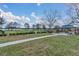 Community park with a picnic shelter, benches, and a fenced dog run at 3050 Grasmere View Pkwy, Kissimmee, FL 34746