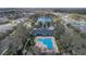 Aerial view of the community pool and clubhouse with scenic pond views at 3050 Grasmere View Pkwy, Kissimmee, FL 34746