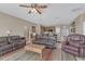 Comfortable living area with ceiling fan and seamless flow into the kitchen at 3050 Grasmere View Pkwy, Kissimmee, FL 34746