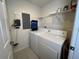 Neat laundry room with full size washer and dryer at 3136 Yellow Lantana Ln, Kissimmee, FL 34747