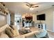 Living room view showcasing open floorplan, tile floors, and connection to the kitchen at 3211 Surfbird St, Kissimmee, FL 34744