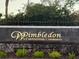 Wimbleton: A condominium community sign with dark brick and neat landscaping at 3240 S Semoran Blvd # 14, Orlando, FL 32822