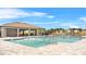 Community swimming pool featuring ample seating and a covered outdoor space at 33436 Country House Dr, Sorrento, FL 32776