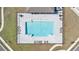 Overhead view of a community swimming pool with surrounding lounge chairs and paved area at 33436 Country House Dr, Sorrento, FL 32776