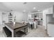 Open concept view of kitchen featuring a center island with bar stools and granite countertops at 33436 Country House Dr, Sorrento, FL 32776