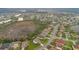 Expansive aerial view of a neighborhood featuring many single Gathering homes and lush greenery at 3452 Goldeneye Ln, St Cloud, FL 34772