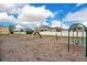 Community playground with swings, a slide, and plenty of open space for children to play at 3452 Goldeneye Ln, St Cloud, FL 34772