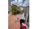 Backyard view showing a fence, palm trees, and building supplies at 350 Corsica Ct, Kissimmee, FL 34758