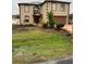 Two-story stucco home featuring a well-maintained front yard and a two-car garage at 350 Corsica Ct, Kissimmee, FL 34758