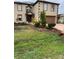 Inviting two-story home featuring a manicured front yard, fountain, and a two-car garage at 350 Corsica Ct, Kissimmee, FL 34758