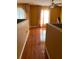 Upstairs hallway with hardwood floors and bright yellow walls at 350 Corsica Ct, Kissimmee, FL 34758