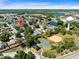 Scenic aerial shot of the residential area, including nearby parks and water tower at 3741 Crossing Creek Blvd, St Cloud, FL 34772