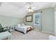 Cozy bedroom with a pitched ceiling, ceiling fan, neutral decor, and natural light creating a peaceful atmosphere at 3741 Crossing Creek Blvd, St Cloud, FL 34772