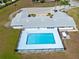 Aerial view of a community pool surrounded by a fence and building at 3741 Crossing Creek Blvd, St Cloud, FL 34772