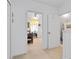 Hallway leading to bedroom and bathroom with neutral carpet flooring at 3741 Crossing Creek Blvd, St Cloud, FL 34772