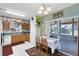 Cozy kitchen with a view to the porch, light wood cabinets, and a dining area at 3741 Crossing Creek Blvd, St Cloud, FL 34772