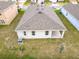 Bird's-eye view of the home, showcasing the backyard and the layout of the property at 417 Tisone Ln, Davenport, FL 33837