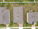 A top-down perspective shows the home's roof, lot size, and proximity to neighboring houses at 417 Tisone Ln, Davenport, FL 33837