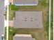 Overhead view showcasing the property's roof and backyard layout with neighborhood streets at 417 Tisone Ln, Davenport, FL 33837