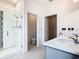 Modern bathroom featuring a glass-enclosed shower and granite-topped vanity at 417 Tisone Ln, Davenport, FL 33837