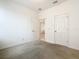 Bedroom with carpeted floor, closet and an open doorway at 417 Tisone Ln, Davenport, FL 33837