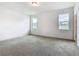 Neutral bedroom with two windows and closet space, providing ample natural light at 417 Tisone Ln, Davenport, FL 33837