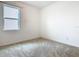 Bedroom with carpet, a large window, and neutral walls at 417 Tisone Ln, Davenport, FL 33837