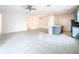 Bright and airy living room with large-format tile, ceiling fan, and modern lighting at 417 Tisone Ln, Davenport, FL 33837