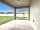 Outdoor covered patio with a concrete floor and views of a fenced yard at 417 Tisone Ln, Davenport, FL 33837