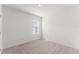 Cozy bedroom featuring neutral carpet and a window at 444 Lily Ln, Davenport, FL 33837