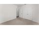 Bedroom featuring neutral carpet and a closet with double doors at 444 Lily Ln, Davenport, FL 33837