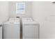 Laundry room featuring a washer, dryer, and a window at 444 Lily Ln, Davenport, FL 33837