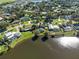 Community aerial view showcasing a variety of homes, green spaces, and a serene lake at 4500 Lake Trudy Dr, St Cloud, FL 34769