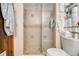 Features a walk-in shower, neutral tiles, and built-in shelving for toiletries at 4500 Lake Trudy Dr, St Cloud, FL 34769