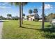 Lovely home with mature palm trees and an expansive front yard with green grass at 4500 Lake Trudy Dr, St Cloud, FL 34769