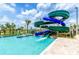 Community pool featuring multiple waterslides for fun and entertainment on sunny days at 4807 Kings Castle Cir, Kissimmee, FL 34746