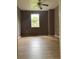 This bedroom has a ceiling fan, fresh paint and new wood-look laminate flooring at 504 Sw Fort King St, Ocala, FL 34471