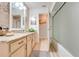 Bathroom with a tub-shower combo, granite counters, and tiled backsplash at 5113 Sage Way, Kissimmee, FL 34758