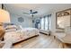 Bedroom with gray walls, ceiling fan, and Paris-themed comforter at 5113 Sage Way, Kissimmee, FL 34758