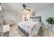 Bedroom with a ceiling fan, chair, and a bed decorated with a Paris-themed comforter at 5113 Sage Way, Kissimmee, FL 34758