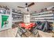 Fun bonus room featuring car collection displays and a central gaming table, lit by a ceiling fan at 5113 Sage Way, Kissimmee, FL 34758